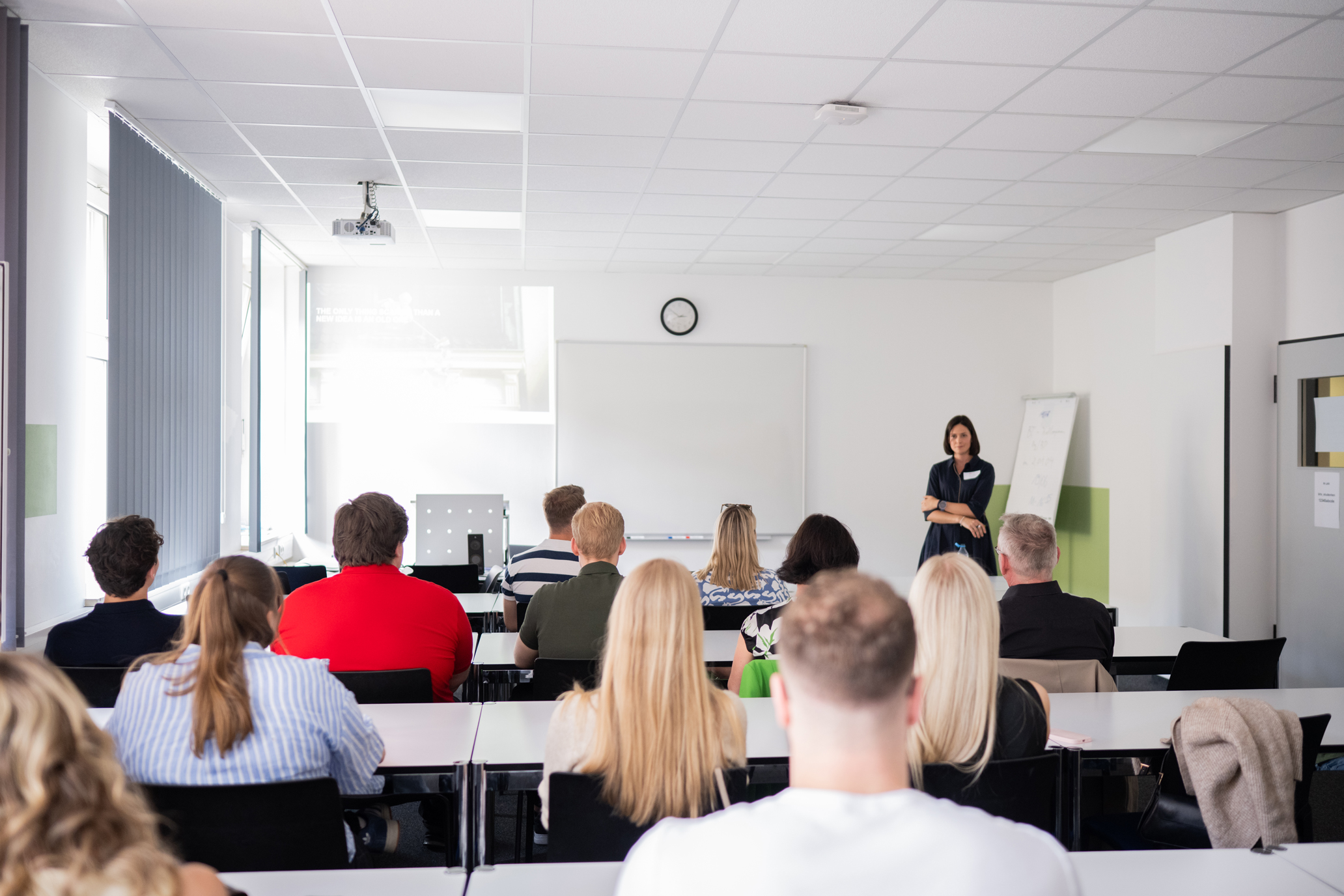 a person giving a presentation to a group of people